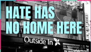 Image showing the entrance to Outside In with the text Hate has no home here