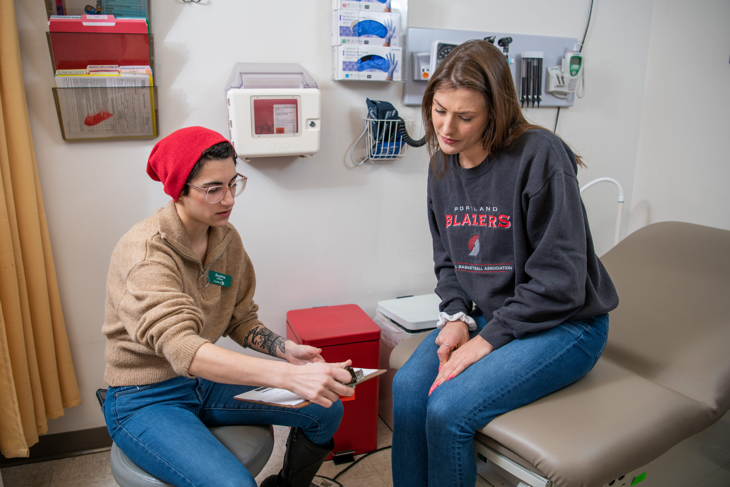 MA and patient in exam room discussing test results